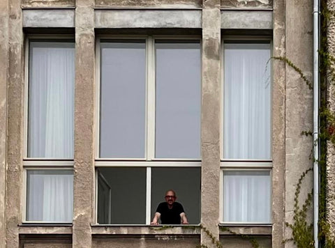 Santiago Borja looking out a window of Villa Heike 